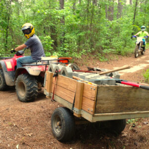 ATV and dirt bike working on a GARTA clean up day at Town Creek OHV